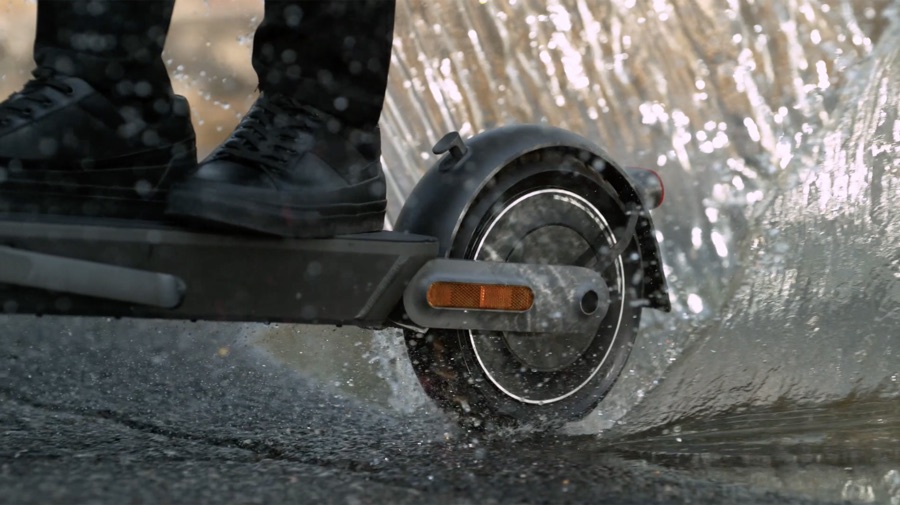 Xiaomi scooter riding through water